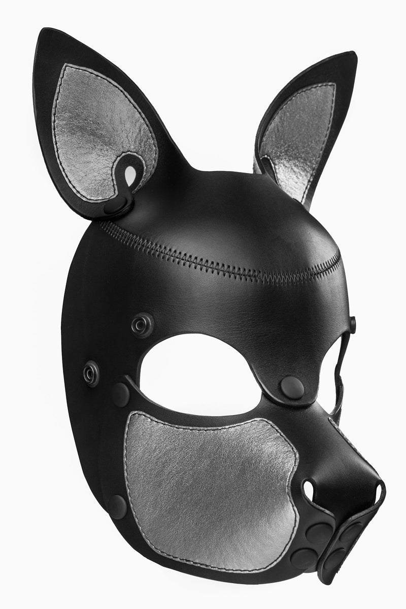 Product photo of a black and metallic silver leather pup mask with pointy ears three quarter view