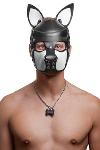 Model wearing a black and white leather pup mask and head harness with stainless steel hardware front view