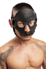 Model wearing black leather head harness and black skull face mask. Front.
