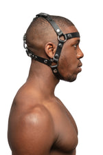 Model wearing black leather head harness with stainless steel hardware, side