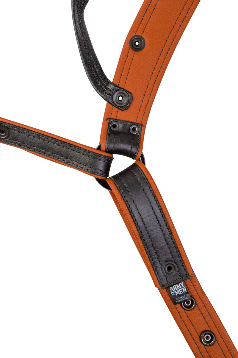 A black and orange combat leather jockstrap. Back view.