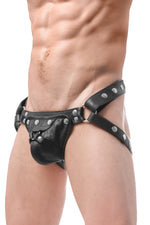 Model wearing a black leather harness jockstrap with stainless steel hardware. Side view.