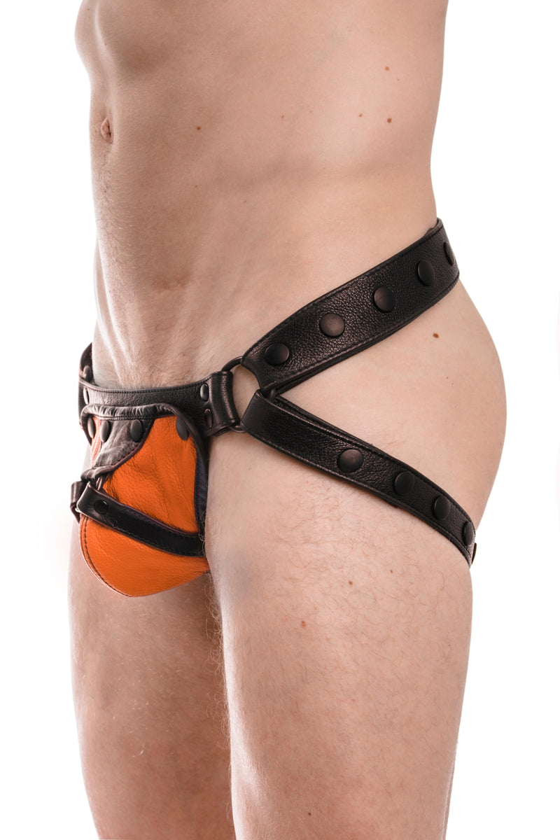 Black leather jockstrap with orange and black leather harness codpiece