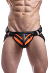 Model wearing a black leather jockstrap with a fluro orange striped codpiece