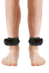 Model wearing army green and black leather ankle restraints
