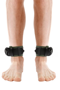 Model wearing army green and black leather ankle restraints