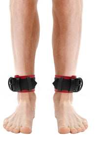 Model wearing red and black leather ankle restraints