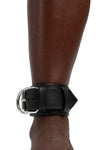 Model wearing black and stainless steel leather ankle restraints