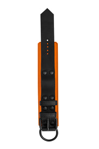 Orange and black leather wrist restraint