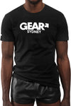 Model wearing black "GEAR SYDNEY" t-shirt. Front view.