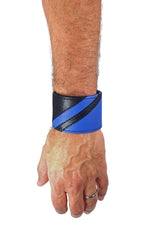 Model wearing a black leather wristband with blue leather chevron detailing. Left Wrist.