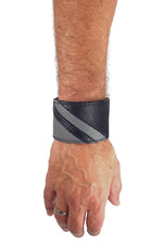Model wearing a black leather wristband with grey leather chevron detailing. Right Wrist.