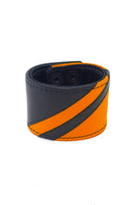 Black leather wristband with orange leather chevron detailing