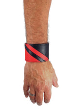 Model wearing a black leather wristband with red leather chevron detailing. Right Wrist.