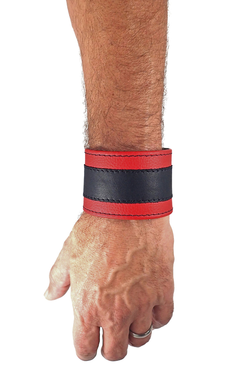 Model wearing a 2" wide leather wristband with red leather racer stripe detailing