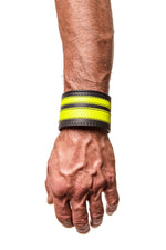 Model wearing a fluro yellow leather stripe wristband