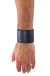 Model wearing a 2" wide black leather wristband