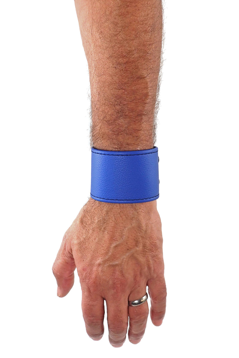 Model wearing a blue leather 2" wide leather wristband