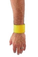 Model wearing a yellow leather 2" wide leather wristband